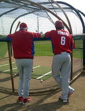 Charlie and Ryan Howard at the batting cage.